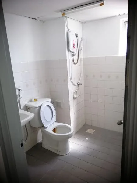Bathroom features: white tiled walls, grey tile flooring, one-piece toilet, single-sink vanity with chrome faucet, shower with wall-mounted water heater, glass shower screen, window for natural light, light fixture on ceiling.