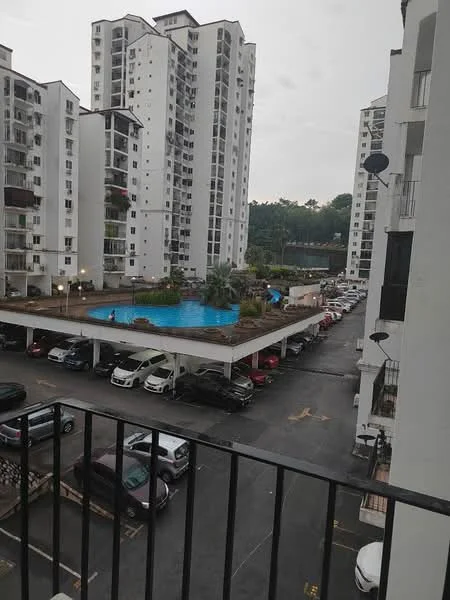 Exterior type: mid-rise condominium; features: swimming pool, pool deck with loungers, covered parking, multiple car parks, landscaped garden area, surrounded by greenery; style: modern.