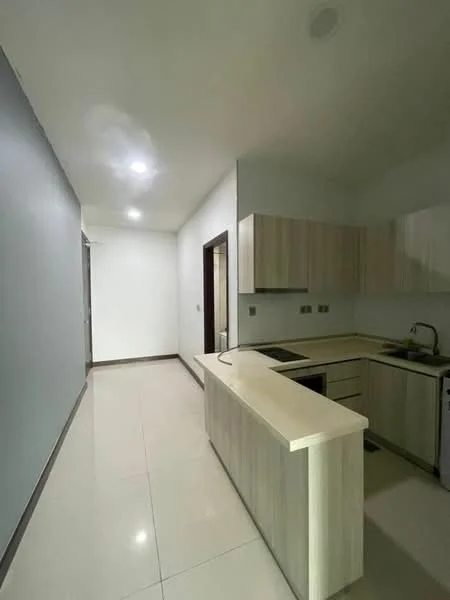 Kitchen features: light wood cabinetry, white countertop, stainless-steel sink, chrome pull-down faucet, built-in stove, tile flooring, recessed downlights, neutral wall color, open layout, kitchen island; style: modern.