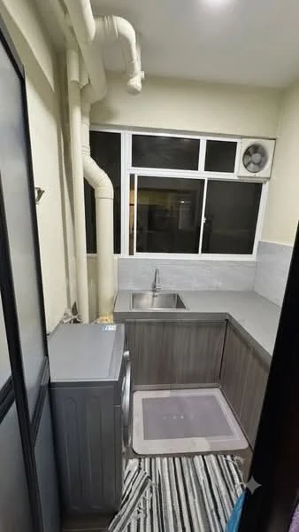 Kitchen features: single-bowl stainless-steel sink, chrome pull-down faucet, grey laminate countertop, grey cabinetry, built-in washing machine, floor-to-ceiling window, wall-mounted air conditioning unit, striped area rug; style: modern.