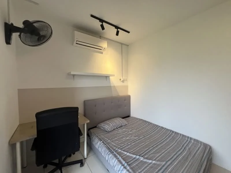 Bedroom features: queen-size bed with striped bedding, upholstered headboard, study desk with chair, wall-mounted split AC unit, track lighting, white painted walls, light-colored flooring, shelf mounted on wall; style: modern.