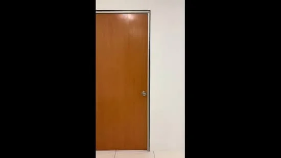 Room features: wooden door, white painted walls, tile flooring.