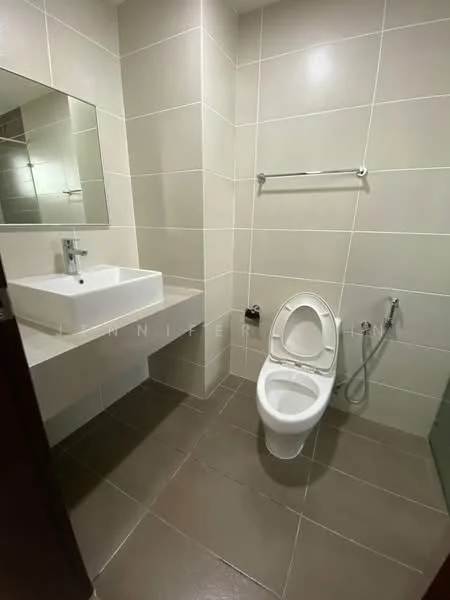Bathroom features: white ceramic toilet, chrome basin mixer faucet, square white sink, wall-mounted mirror, grey tiled walls, dark grey floor tiles, handheld bidet spray, wall-mounted towel bar; style: modern.