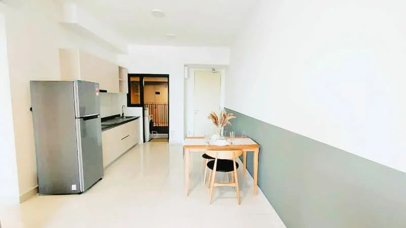 Kitchen features: stainless-steel fridge, kitchen cabinets in light wood, black countertop, single-bowl stainless-steel sink, chrome pull-down faucet, ceramic tile flooring, wall-mounted light fixtures, dining table with wooden legs, black upholstered dining chair, white painted walls, grey accent wall; style: modern.