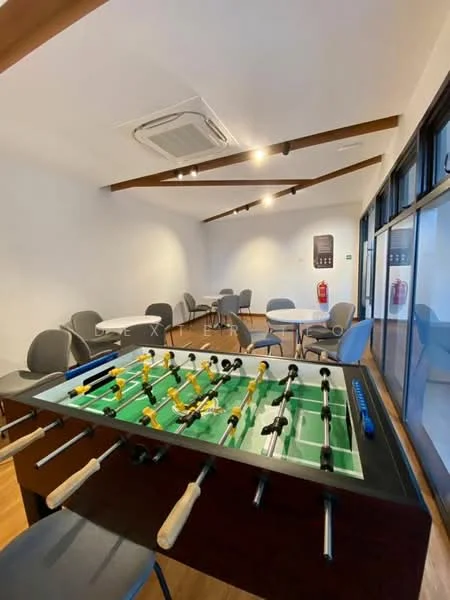 Room features: foosball table, wooden flooring, exposed wooden beams, recessed downlights, wall-mounted air conditioning unit, tables, chairs, fire extinguisher, large windows, neutral wall color; style: modern.