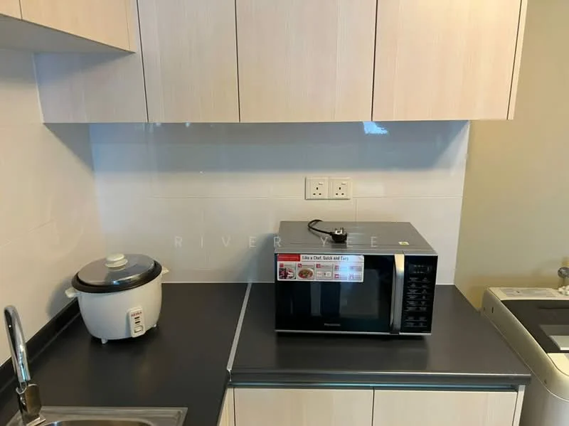 Kitchen features: white laminate cabinetry, black countertop, stainless-steel sink, microwave, rice cooker, white tiled backsplash, built-in washing machine, under-cabinet lighting; style: modern.