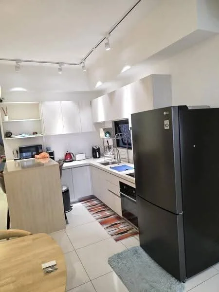 Kitchen features: white cabinets, black refrigerator, built-in oven, stainless-steel sink, chrome pull-down faucet, microwave, ceramic tile flooring, recessed lighting, countertop with breakfast bar, open shelving, kitchen rug, dishwasher, kettle; style: modern.