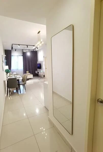 Room features: white painted walls, glossy tile flooring, large mirror with thin frame, recessed ceiling lights, track lighting, floor-to-ceiling windows with sheer curtains, dining table with chairs visible in background, sofa visible in background, TV console visible in background; style: modern.