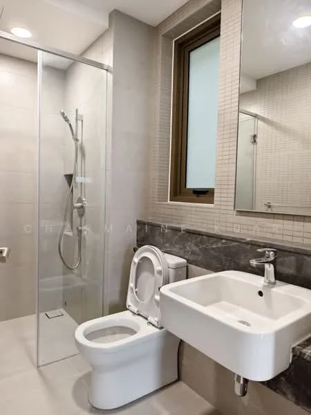 Bathroom features: walk-in shower with glass enclosure, rain shower head, handheld shower, white wall-mounted sink, chrome basin mixer faucet, one-piece toilet, framed mirror, tile cladding on walls, grey stone countertop, light grey floor tiles, window with frosted glass, built-in shelving; style: modern.