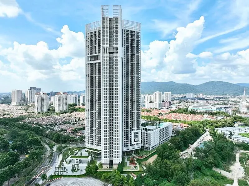 Exterior type: high-rise condominium; features: glass curtain wall, white painted facade, recessed balconies, vertical fins, surrounded by mature greenery, landscaped garden at base, multiple storeys, urban context with city skyline in background; style: modern.