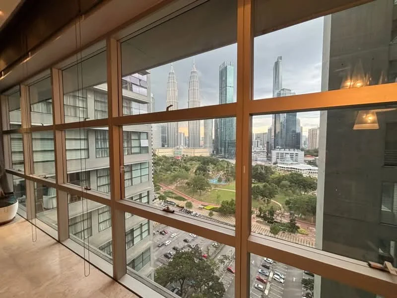 Room features: floor-to-ceiling windows, city skyline view, wooden flooring, modern lighting fixtures, open layout, curtains, concrete walls, decorative elements; style: modern; view: city.