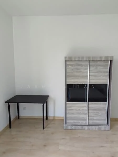 Room features: light wood flooring, white painted walls, black table, sliding door cabinet with wood finish.