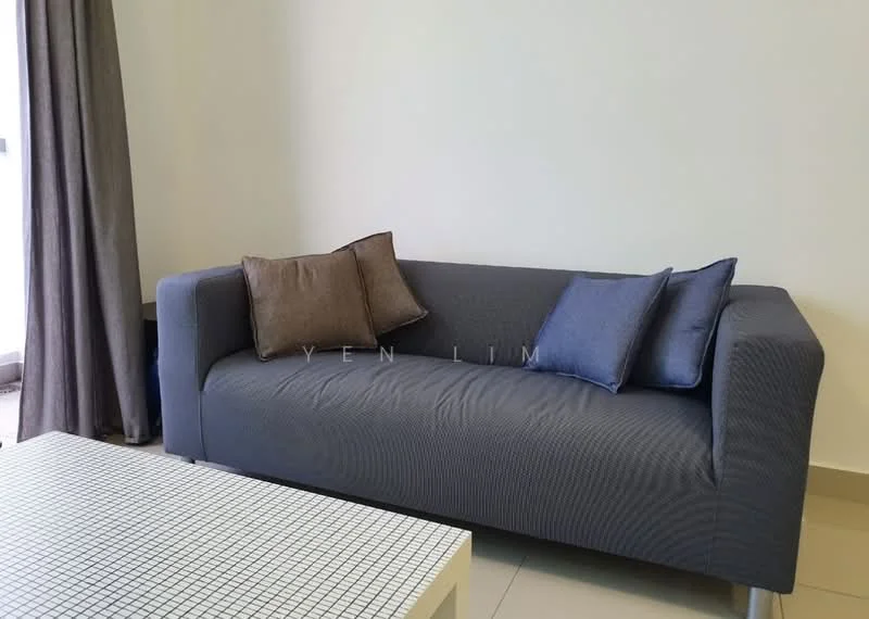 Living features: grey fabric sofa, two decorative cushions in brown and blue, white coffee table with grid pattern, cream painted walls, floor-to-ceiling window with sheer curtains, light-colored tiled flooring; style: modern.