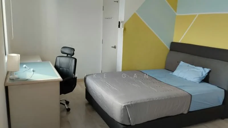 Bedroom features: queen-size bed with grey upholstered headboard, light blue bedding, wooden desk with light blue top, black office chair, white painted walls, accent wall with geometric yellow and blue pattern, laminate flooring, window with natural light, door to hallway; style: modern.