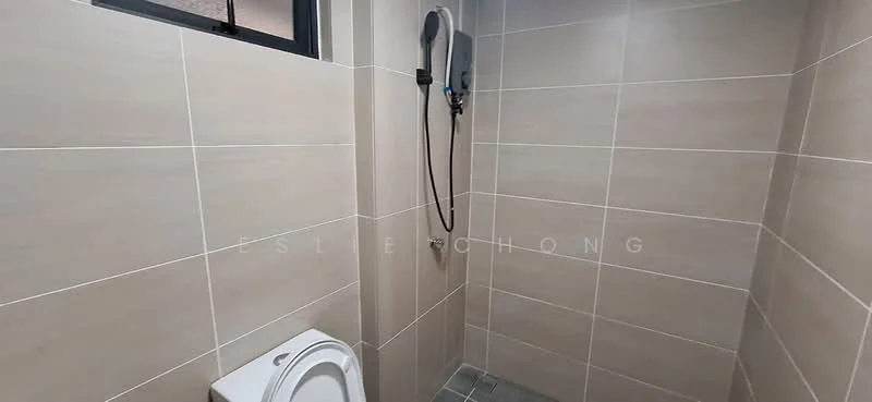 Bathroom features: one-piece toilet, shower with handheld showerhead, grey tile flooring, beige wall tiles, wall-mounted shower unit, window for natural light; style: modern.