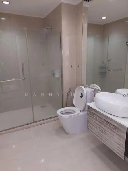 Bathroom features: glass shower enclosure, rain shower head, single-sink vanity with wood cabinet, white ceramic basin, one-piece toilet, tile flooring, cream tiled walls, mirror above vanity, chrome faucet, towel rail; style: modern.