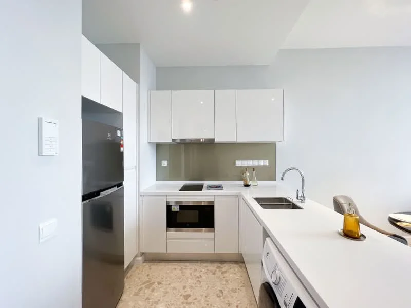 Kitchen features: white cabinetry, stainless-steel fridge, built-in oven, ceramic cooktop, black countertop, single-bowl stainless-steel sink, chrome pull-down faucet, tile backsplash, washer-dryer combo, marble tile flooring, recessed downlights; style: modern.