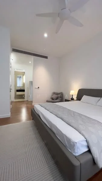 Bedroom features: queen-size bed with grey upholstered headboard, white bedding, light grey throw blanket, 2 bedside lamps, wooden flooring, 5-blade ceiling fan, decorative wall mirror, area rug with geometric pattern, grey bean bag chair, wall-mounted light switch, white painted walls, recessed downlights; style: modern.