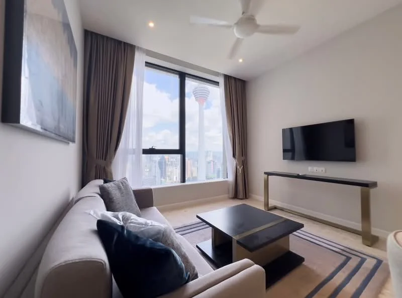 Living features: 3-seater fabric sofa in light grey, decorative cushions in blue, black coffee table with gold accents, wall-mounted flat-screen TV, floor-to-ceiling windows, sheer curtains, dark wood console table, recessed downlights, ceiling fan with light, neutral wall colour, carpet with geometric pattern; style: modern; view: city.
