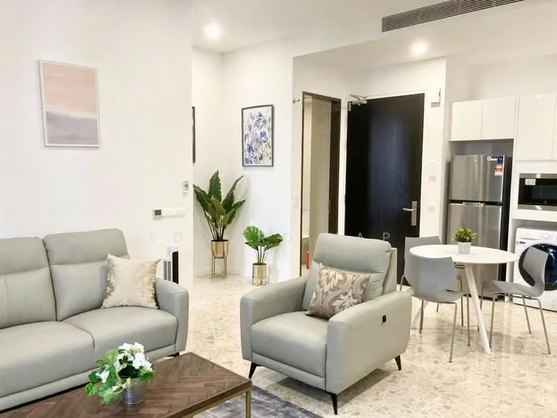 Living features: light grey fabric 3-seater sofa, light grey armchair, wooden coffee table with geometric pattern, decorative cushions, framed artwork on wall, potted plants, marble flooring, recessed ceiling lights; style: modern. Dining features: round dining table for four, white dining chairs, built-in cabinetry, stainless-steel refrigerator, built-in oven, microwave, kitchen countertop, wall-mounted artwork; style: modern.