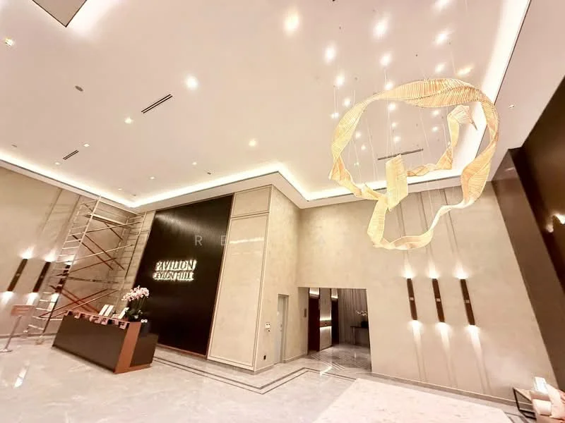 Lobby features: marble flooring, high ceiling, chandelier with intricate design, reception desk, wall with backlit signage, scaffolding for construction, modern lighting fixtures, neutral wall colour, decorative wall paneling; style: modern.