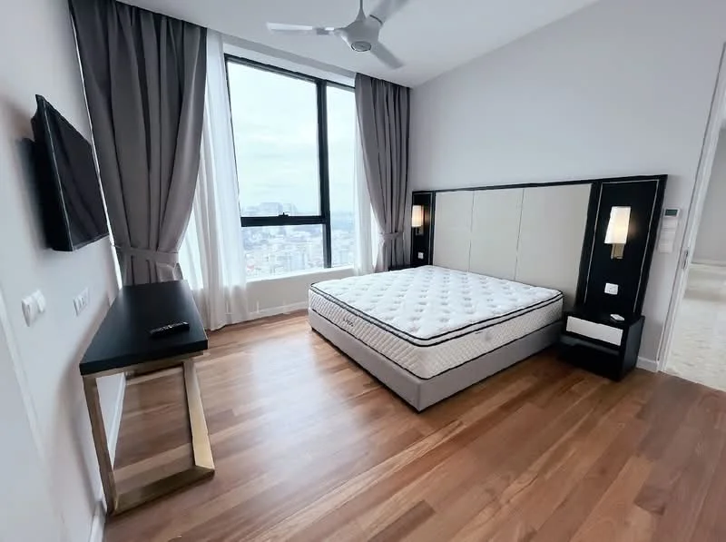 Bedroom features: queen-size bed, upholstered headboard, wooden bedside table, wall-mounted TV, floor-to-ceiling window, grey curtains, wooden flooring, ceiling fan, decorative wall sconce; style: modern; view: city.