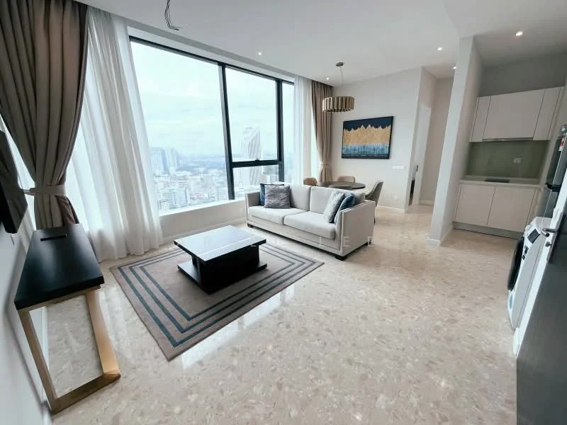 Living features: floor-to-ceiling windows, cream painted walls, marble flooring, 3-seater fabric sofa in light grey, coffee table, area rug with geometric pattern, wall-mounted artwork, recessed downlights, curtains, TV console, decorative wall clock; style: modern; view: city.