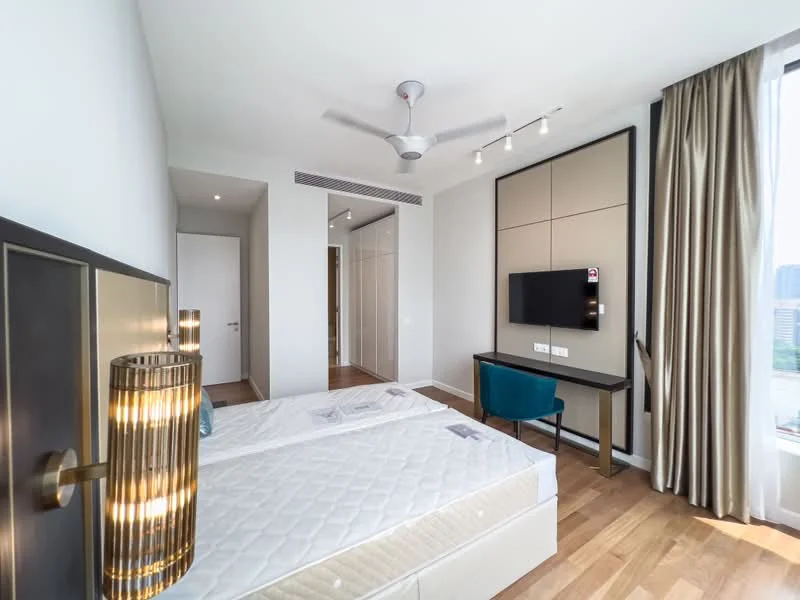 Bedroom features: queen-size bed, wooden flooring, 5-blade ceiling fan, wall-mounted TV, built-in wardrobe, large window with city view, curtains, study desk with chair, decorative wall panel; style: modern; view: city.