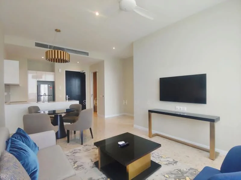 Living features: 3-seater fabric sofa in light grey, coffee table with black top and gold legs, wall-mounted TV, ceiling fan, decorative wall with light colour, area rug with abstract pattern, dining table for 4 with upholstered chairs, open layout to kitchen, light marble flooring; style: modern. Kitchen features: white cabinetry, stainless-steel fridge, open kitchen layout, countertop with bar seating, ceramic tile backsplash; style: modern.