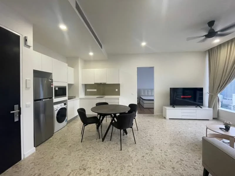 Kitchen features: white cabinetry, built-in microwave, stainless-steel fridge, front-load washing machine, ceramic tile flooring, grey backsplash, single-bowl stainless-steel sink, chrome pull-down faucet, 4-burner gas hob, exhaust hood; style: modern. Living features: round dining table with black chairs, 3-seater fabric sofa, TV console, wall-mounted TV, large window with curtains, decorative wall art, area rug, ceiling fan, light-colored walls, stone flooring; style: modern.