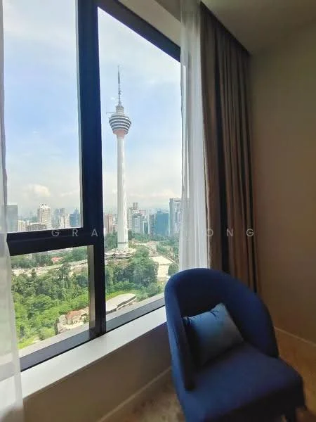 Room features: floor-to-ceiling windows, curtains, blue accent chair, decorative cushion, city skyline view, wooden flooring, neutral wall color, window sill; style: modern; view: city.