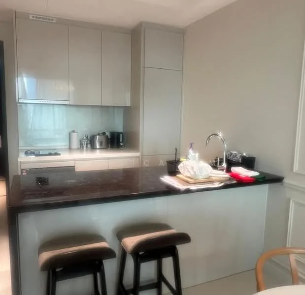 Kitchen features: light grey cabinetry, black granite countertop, single-bowl stainless-steel sink, chrome pull-down faucet, built-in oven, freestanding range oven, stainless-steel kettle, stainless-steel coffee machine, bar stools, open shelving, recessed downlights, white painted walls; style: modern.