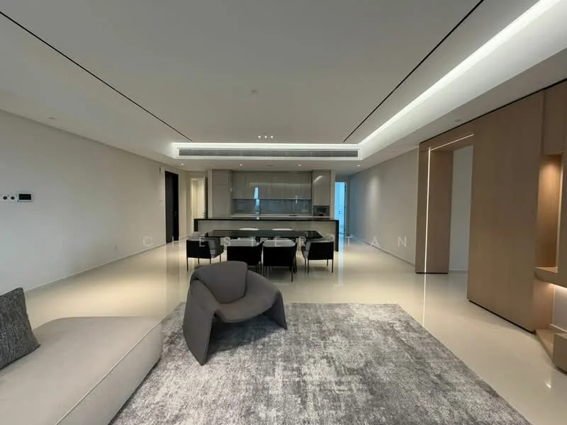 Living features: light-coloured walls, polished tile flooring, recessed downlights, large windows with city view, area rug with geometric pattern, sectional sofa in light grey, armchair in dark grey, dining table with chairs, open layout to kitchen, minimalist decor; style: modern; view: city. Kitchen features: kitchen island with seating, stainless-steel appliances, white cabinetry, glass backsplash, built-in oven, induction cooktop, recessed lighting, open shelving; style: modern; view: city.