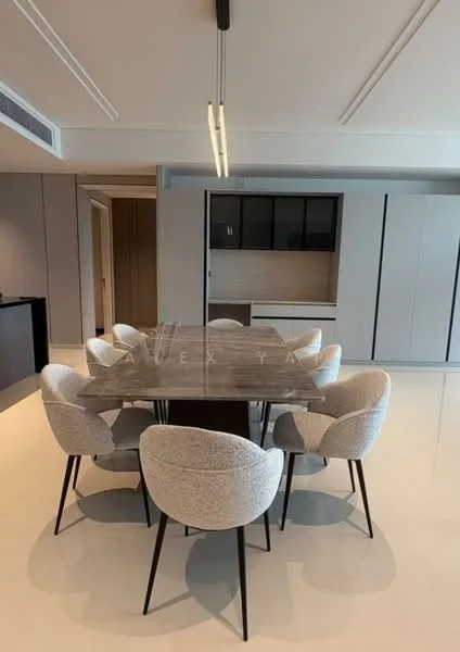 Dining features: 6-seater dining table, rectangular dining table with wood top, upholstered dining chairs in light grey, polished concrete flooring, recessed ceiling lights, built-in cabinetry with black glass doors, neutral wall color, open layout to kitchen area; style: modern.