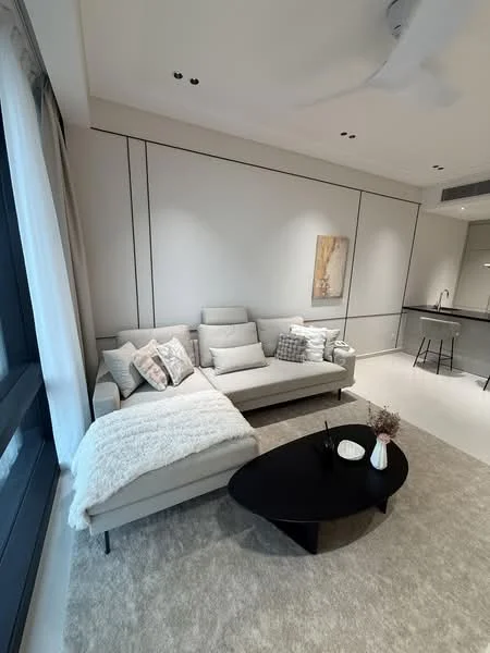 Living features: L-shape sectional sofa in light grey, decorative throw pillows, area rug in light beige, black coffee table, wall-mounted artwork, white walls with paneling, recessed ceiling lights, ceiling fan, large windows with sheer curtains, neutral-colored throw blanket; style: modern.