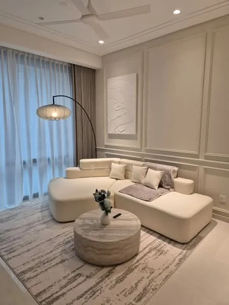 Living features: curved white sectional sofa, decorative throw pillows, round marble coffee table, area rug with geometric pattern, floor lamp with a round shade, light-colored walls with paneling, sheer curtains, recessed ceiling lights, ceiling fan, wooden flooring; style: modern.