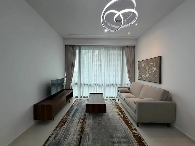 Living features: light grey fabric sofa, wooden coffee table, wall-mounted TV, TV console in wood, area rug with geometric pattern, floor-to-ceiling windows, sheer curtains, chandelier with modern design, white painted walls, recessed downlights; style: modern; view: city.