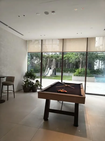 Room features: pool table, large glass windows, sliding door, indoor plants, tile flooring, recessed ceiling lights, roller blinds, view of outdoor slide, view of landscaped garden, open layout; style: modern; view: garden.