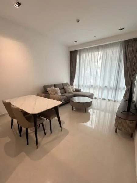 Living features: light grey fabric sectional sofa, marble-top coffee table, 4-seater dining table with beige upholstered chairs, floor-to-ceiling windows with sheer curtains, white painted walls, polished ceramic tile flooring, wall-mounted TV, recessed downlights; style: modern; view: city.