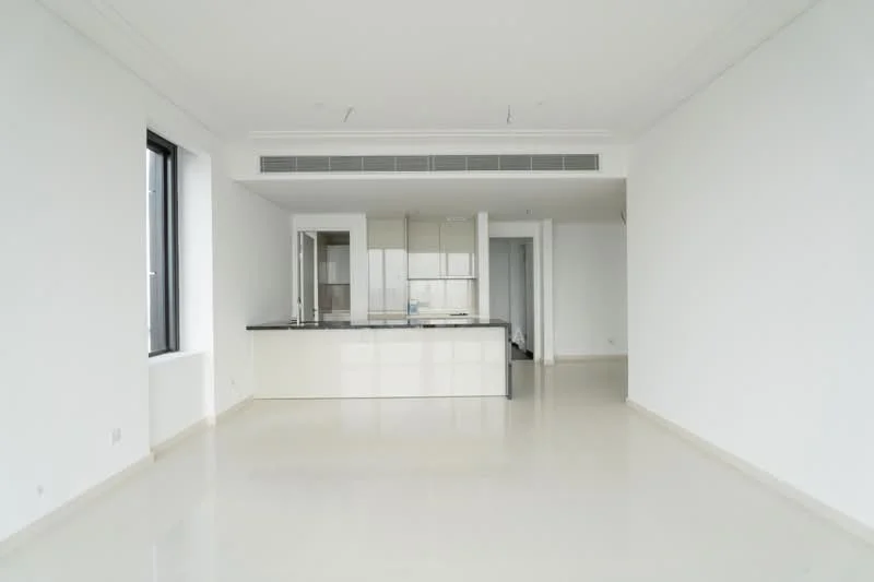 Living features: white painted walls, polished concrete flooring, recessed downlights, floor-to-ceiling windows, open-plan layout, kitchen island with black countertop, white cabinetry, no visible furniture; style: modern.