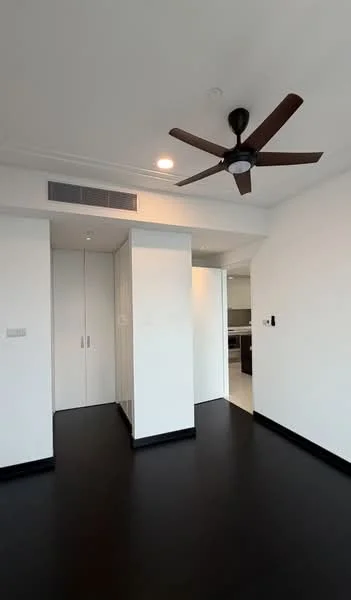 Room features: black vinyl flooring, white painted walls, 5-blade ceiling fan, recessed downlights, built-in wardrobe with sliding doors, doorway leading to another room, air conditioning vent; style: modern.