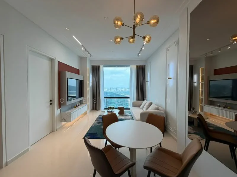Living features: floor-to-ceiling windows, city view, light grey sectional sofa, coffee table, wall-mounted TV, entertainment unit, recessed downlights, chandelier with multiple bulbs, cream painted walls, polished tile flooring, decorative wall paneling, area rug with geometric pattern; style: modern.