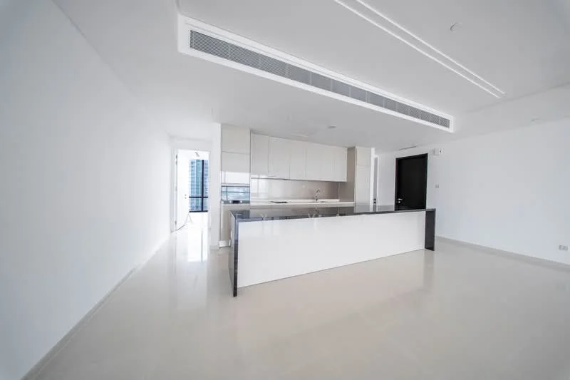 Kitchen features: white cabinetry, grey countertop, island with seating, stainless-steel sink, chrome pull-down faucet, built-in oven, freestanding range oven, recessed LED downlights, smooth plastered walls, glossy tile flooring, floor-to-ceiling windows, open layout; style: modern; view: city.