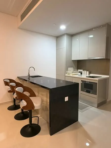 Kitchen features: black granite countertop, kitchen island with seating, three bar stools with wooden seats, built-in oven, stainless-steel sink, chrome pull-down faucet, flat-panel cabinetry in light grey, ceramic tile flooring, recessed LED downlights, white walls; style: modern.