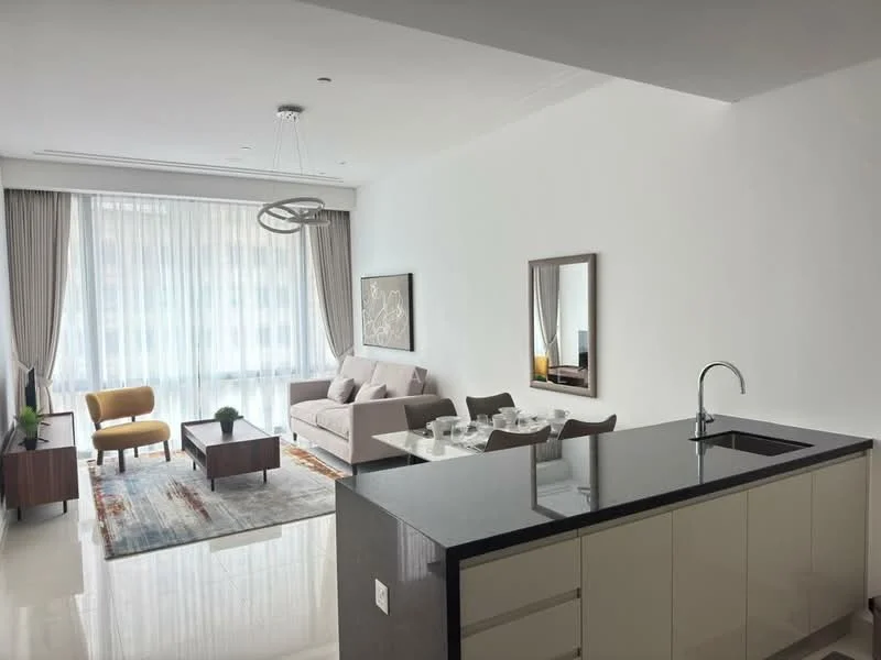 Living features: floor-to-ceiling windows, sheer curtains, 3-seater fabric sofa in light grey, armchair in mustard yellow, coffee table, area rug with geometric pattern, wall-mounted mirror, decorative wall art, recessed downlights, ceiling pendant light, potted plant, TV console, dining table with chairs, open kitchen layout, black granite countertop; style: modern; view: city. Kitchen features: black granite countertop, single-bowl stainless-steel sink, chrome pull-down faucet, flat-panel cabinetry in light colour, open shelving, recessed downlights; style: modern.