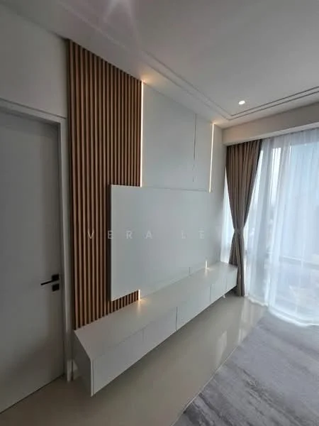 Living features: white wall-mounted TV console, wood panel accent wall, recessed lighting, floor-to-ceiling windows, sheer curtains, light grey area rug, polished tile flooring, neutral wall color; style: modern.