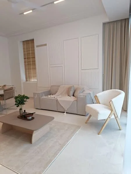 Living features: light grey fabric sofa, beige throw blanket on sofa, wooden coffee table, area rug in light beige, white walls with paneling, large window with sheer curtains, wooden blinds, white accent chair with wooden legs, decorative plant on coffee table; style: modern.