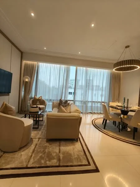 Living features: cream painted walls, marble flooring, recessed downlights, chandelier, floor-to-ceiling windows, sheer curtains, 3-seater fabric sofa in cream, 2 accent chairs in cream, coffee table, area rug with geometric pattern, TV mounted on wall, dining table with upholstered chairs; style: modern; view: city.