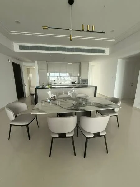 Dining features: 6-seater dining table with marble top, upholstered dining chairs in light color, pendant light fixture with multiple bulbs, white walls, light-colored flooring, open layout to kitchen, floor-to-ceiling windows, recessed ceiling lights, decorative wall paneling; style: modern. Kitchen features: kitchen island with bar seating, stainless-steel appliances, white cabinetry, glass backsplash, built-in oven, freestanding range oven, microwave, refrigerator, under-cabinet lighting; style: modern.