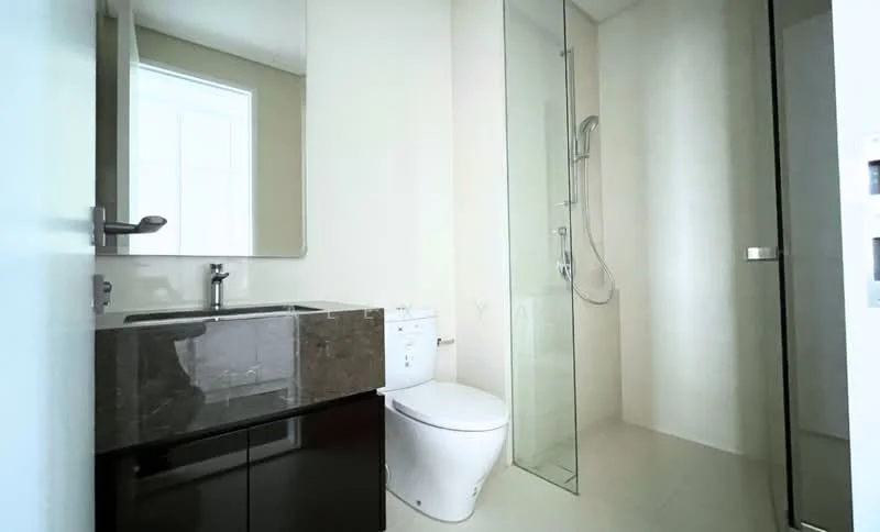 Bathroom features: single-sink vanity with dark cabinetry, mirror above vanity, chrome basin mixer faucet, one-piece toilet, walk-in shower with glass enclosure, rain shower head, light-colored tile flooring, neutral painted walls; style: modern.